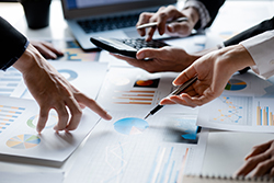Real estate website design team looking over business statistics